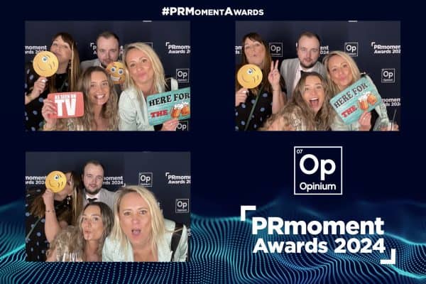 A photo collage of four images shows five people posing with props at the PRmoment Awards 2024 event, featuring a backdrop with the event branding and hashtag #PRMomentAwards. traditional photo booth photo