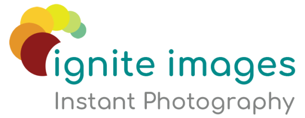 Logo of Ignite Images Instant Photography with stylized colorful half-circles above the text.